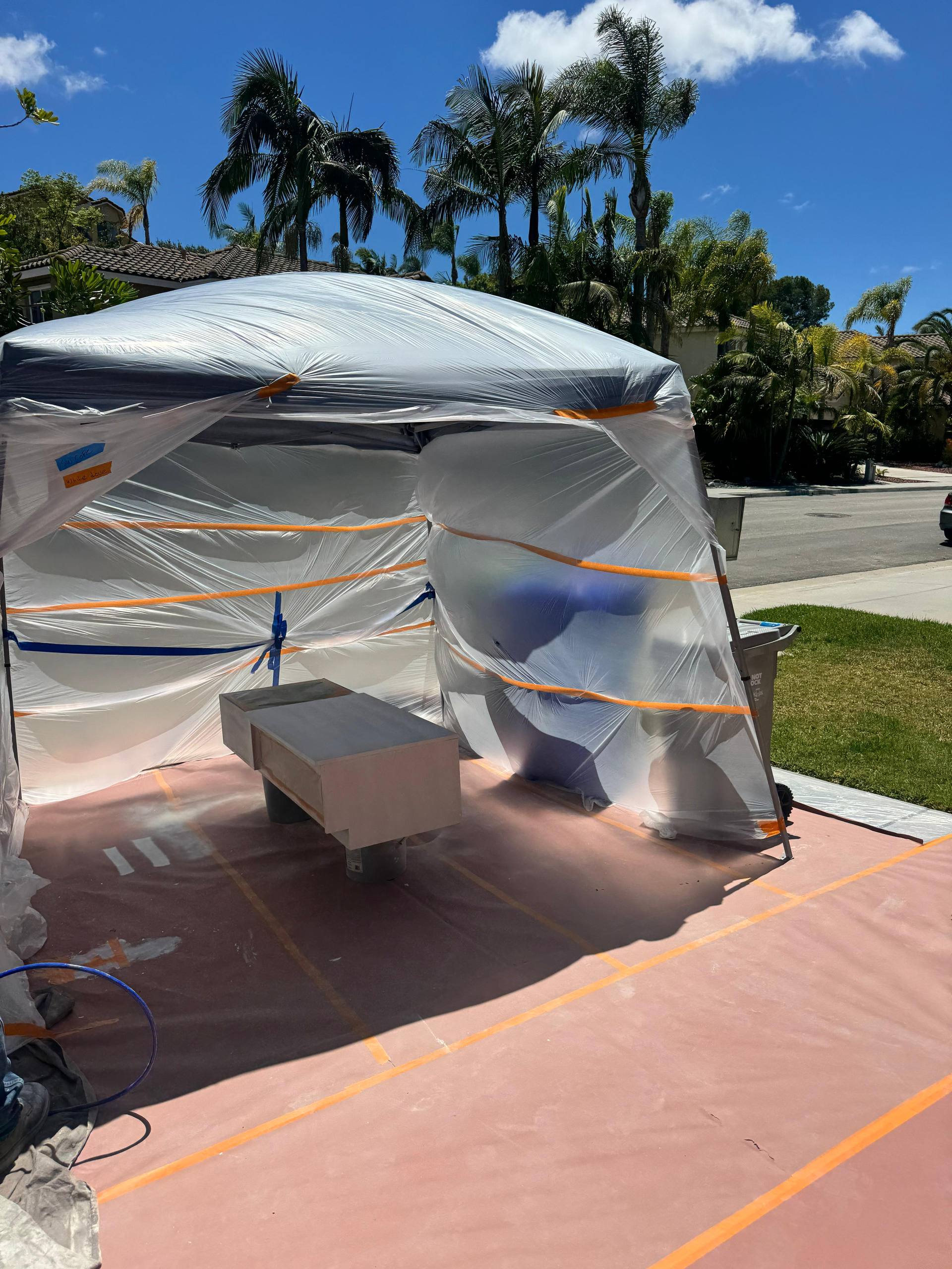Outdoor spray-paint tent setup, Orange County