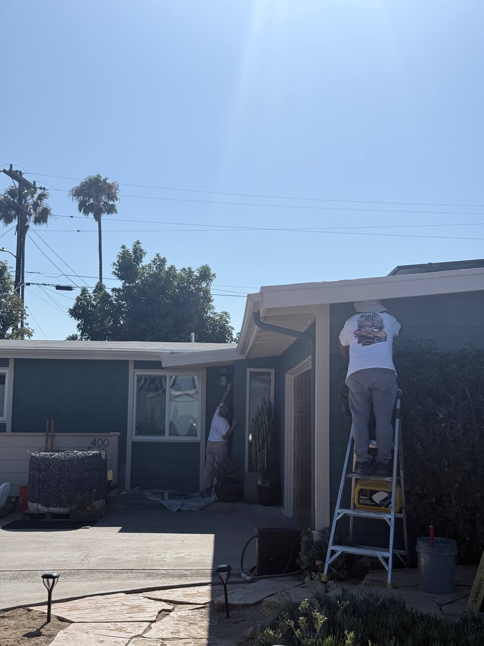 Ross Painting Group crew painting a San Diego home exterior