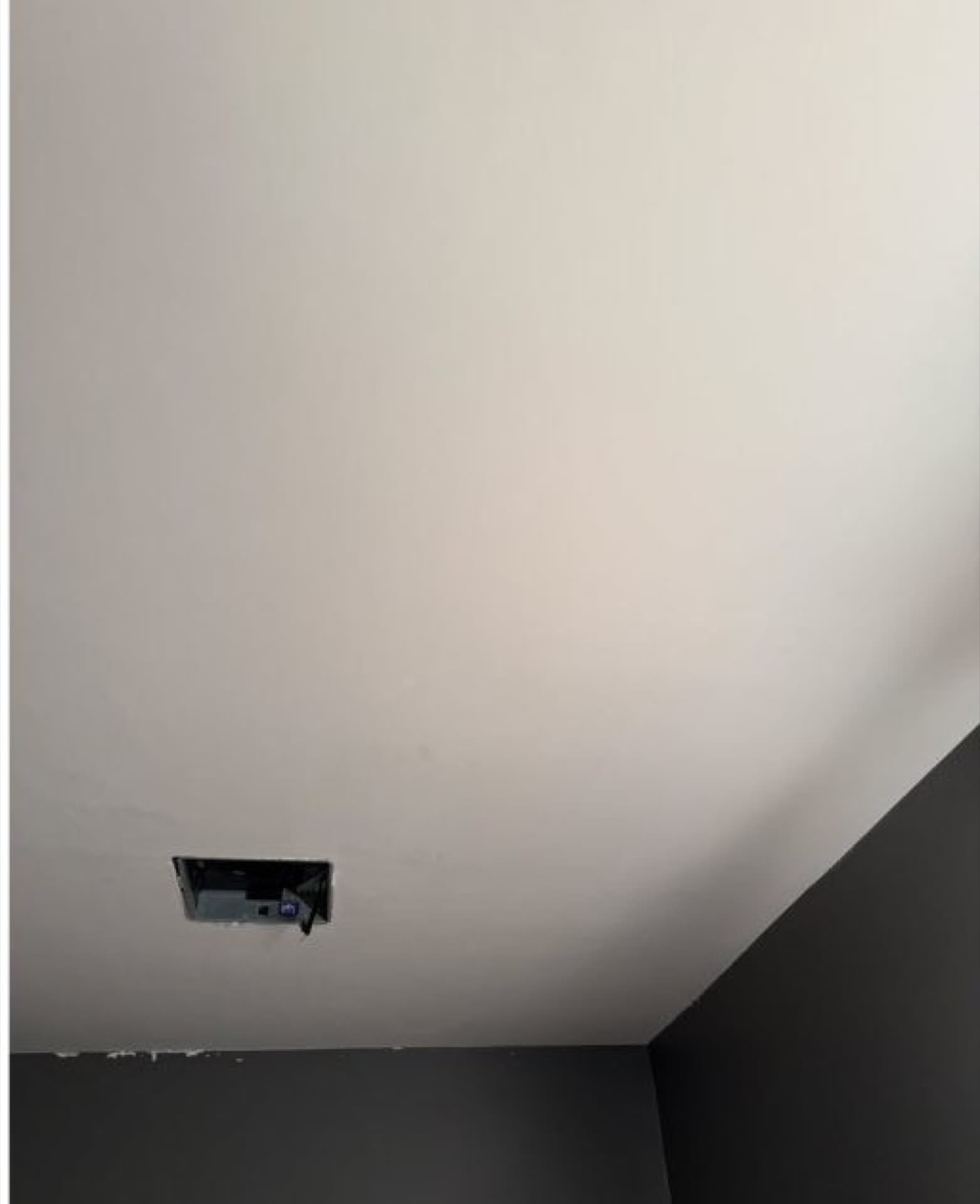 Smooth ceiling after popcorn texture removal by Ross Painting Group