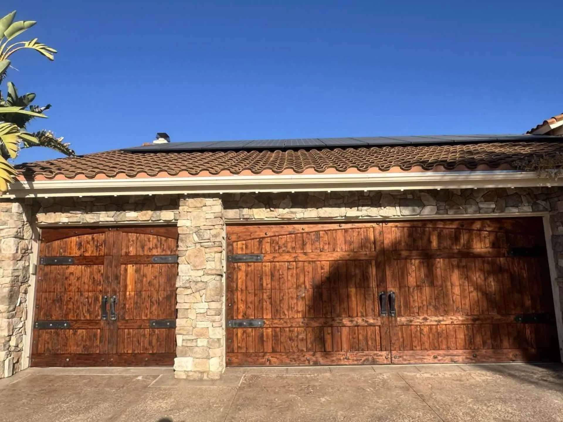 Beautiful wood-stained garage doors with rich warm finish