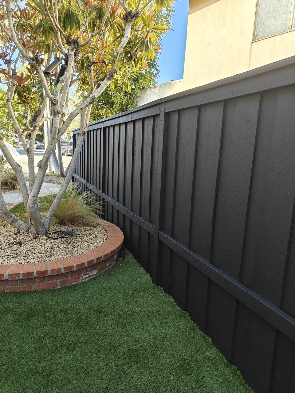 Freshly stained wood fence, Orange County